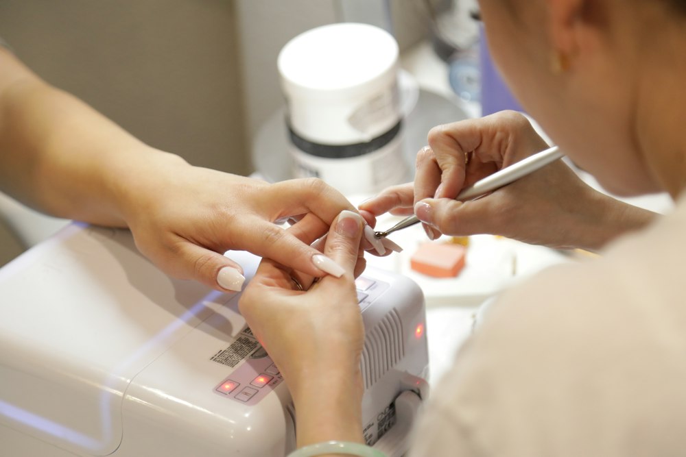 Groomed hands with spa manicure and clean glossy polish